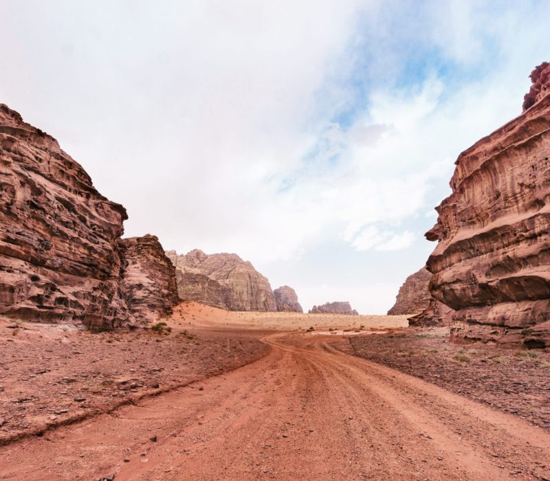 Wadi Rum desert, Jordan, Middle East, The Valley of the Moon. Orange sand, haze, clouds.